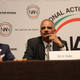 Former Attorney General Eric Holder sits with the Rev. Al Sharpton at the National Action Network Convention in New York City on April 18, 2018.
